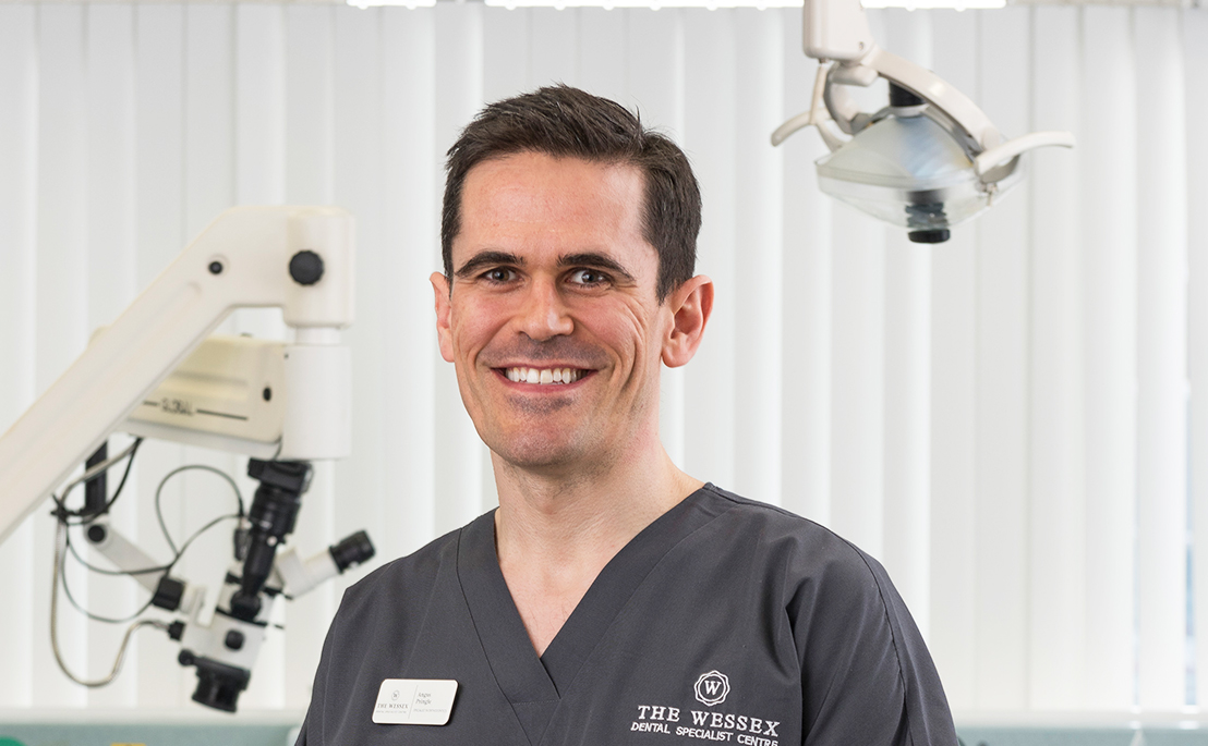 Angus Pringle, Specialist Orthodontist in Fareham, providing calm, personalised orthodontic care during a patient consultation
